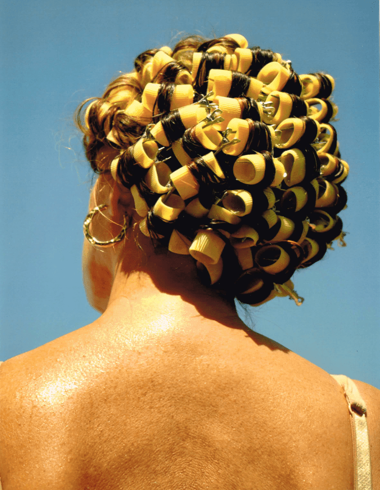 a women with pasta curls