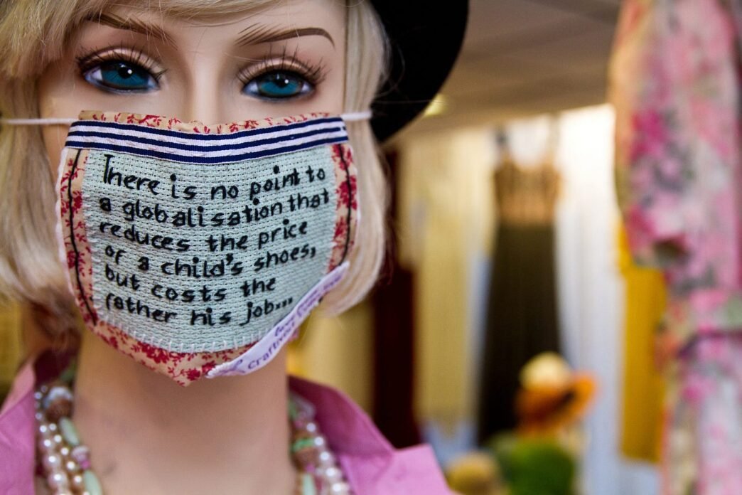 A Mannequin wearing a craftivist mask