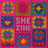 Granny squares with the words She Zine stitched in the middle