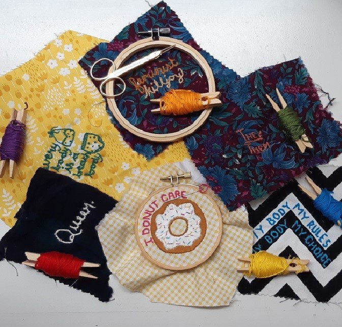 A pile of craft supplies for craftivist making