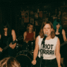 a riot grrrl band playing in a dive bar generated by chatgpt