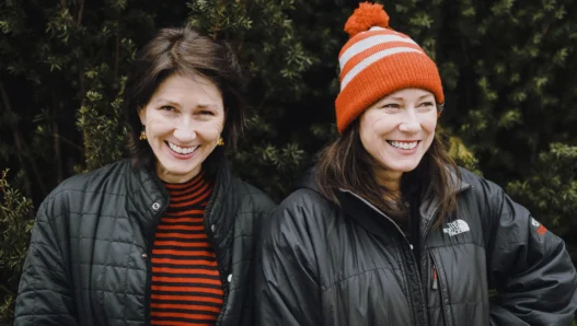 Kim and Kelley deal casually posing outside in winter garb.