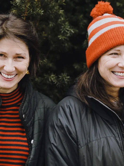 Kim and Kelley deal casually posing outside in winter garb.
