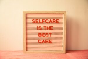 A bulletin board that reads "selfcare is the best care"