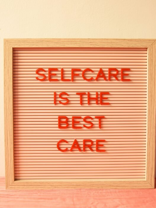 A bulletin board that reads "selfcare is the best care"