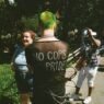 A punk with the writing 'No Cops at Pride' on the back of their shirt.