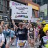 Protesters at a Pride parade supporting queer healthcare workers and patients.